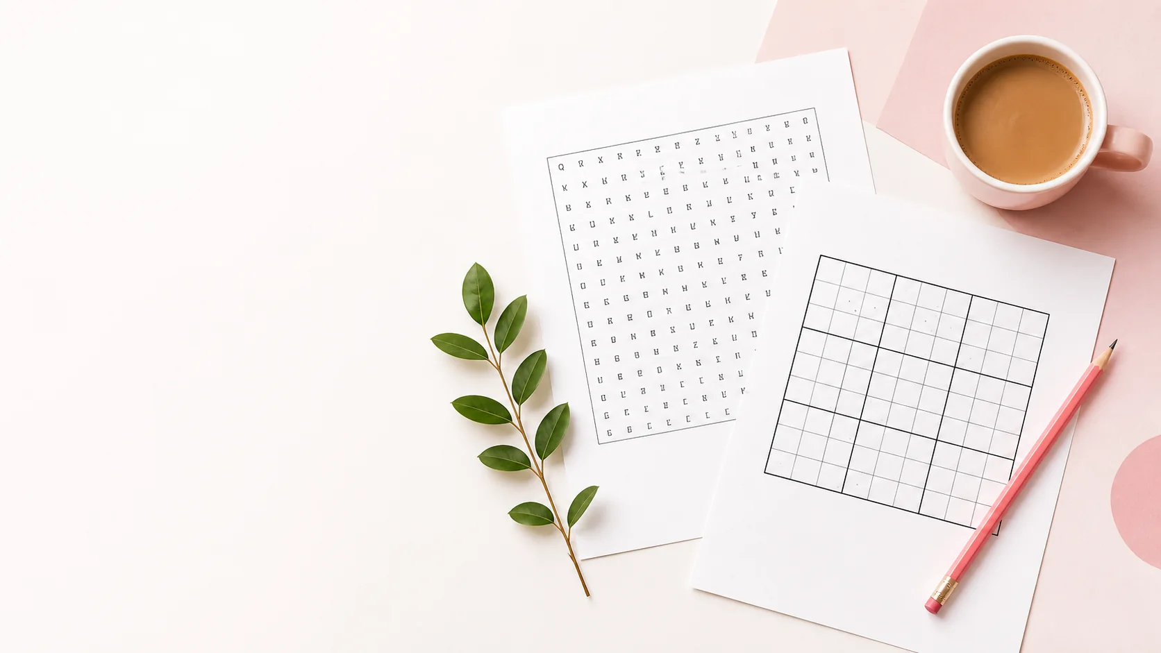 Printable word search and Sudoku sheets on a bright desk beside coffee, pencil and a leafy branch